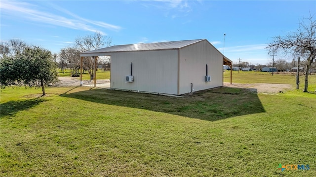 view of outbuilding featuring a lawn