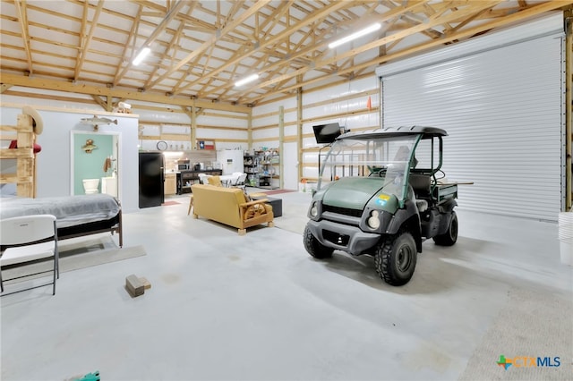 garage featuring black refrigerator