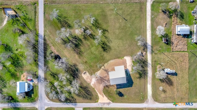 birds eye view of property with a rural view