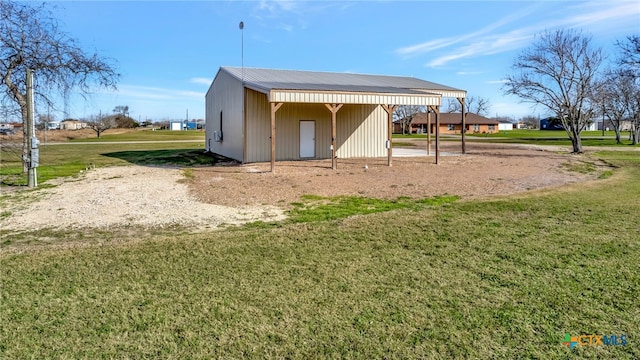 view of outdoor structure with a lawn