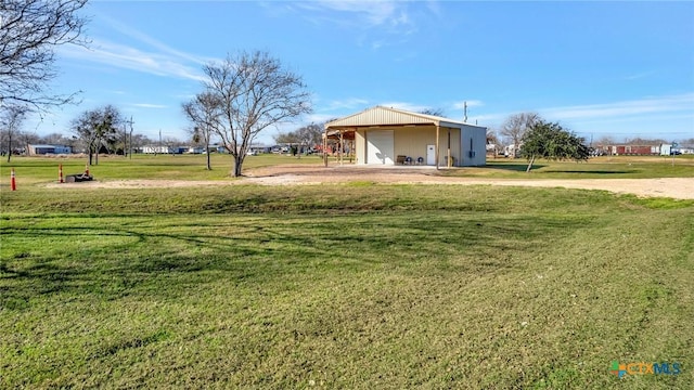 407 W Oakland Ave, Seadrift, TX 77983 - view of green lawn with a garage and an outdoor structure