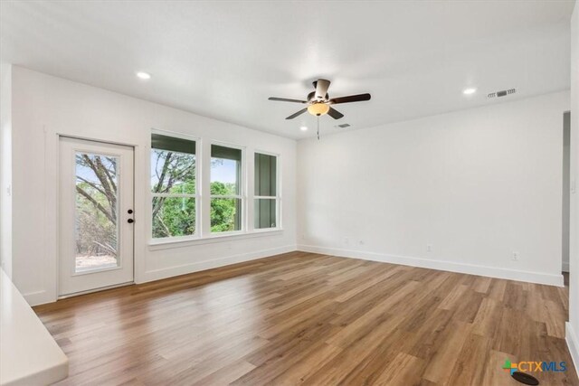 5116 Goliad Dr, Temple, TX 76502 - empty room featuring light wood-type flooring, ceiling fan, baseboards, and recessed lighting