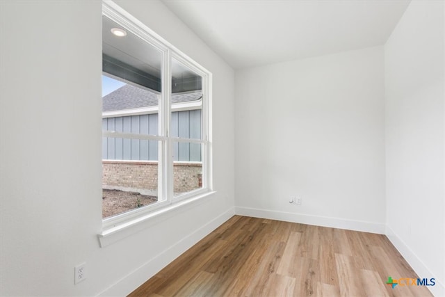 spare room with light hardwood / wood-style floors