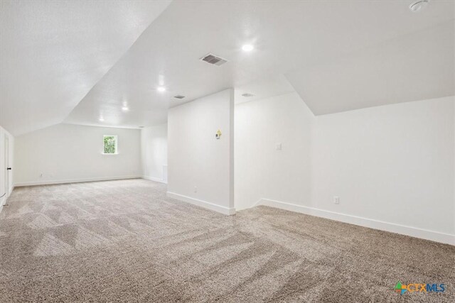 5116 Goliad Dr, Temple, TX 76502 - bonus room featuring light carpet, lofted ceiling, and baseboards