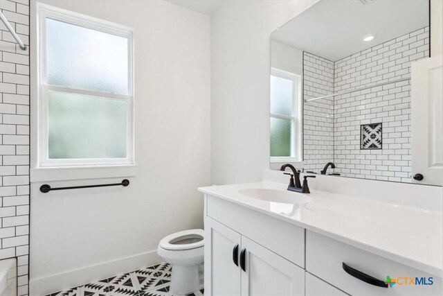 5116 Goliad Dr, Temple, TX 76502 - bathroom featuring vanity, toilet, tile patterned floors, baseboards, and bathing tub / shower combination