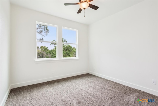 spare room featuring carpet flooring and ceiling fan