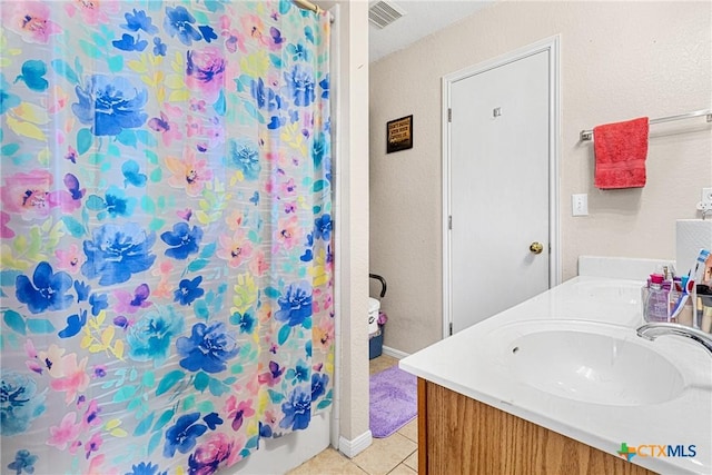 bathroom featuring vanity and tile patterned floors