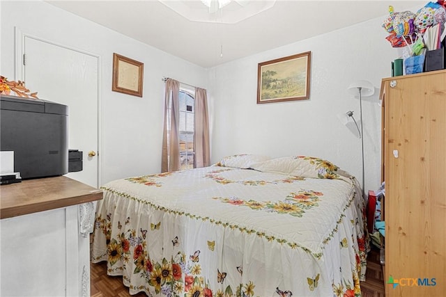 bedroom with parquet flooring