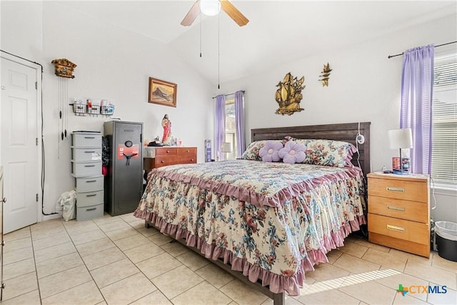 bedroom with ceiling fan, lofted ceiling, and light tile patterned floors