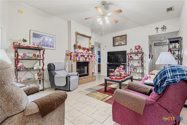 living room with light tile patterned floors and ceiling fan