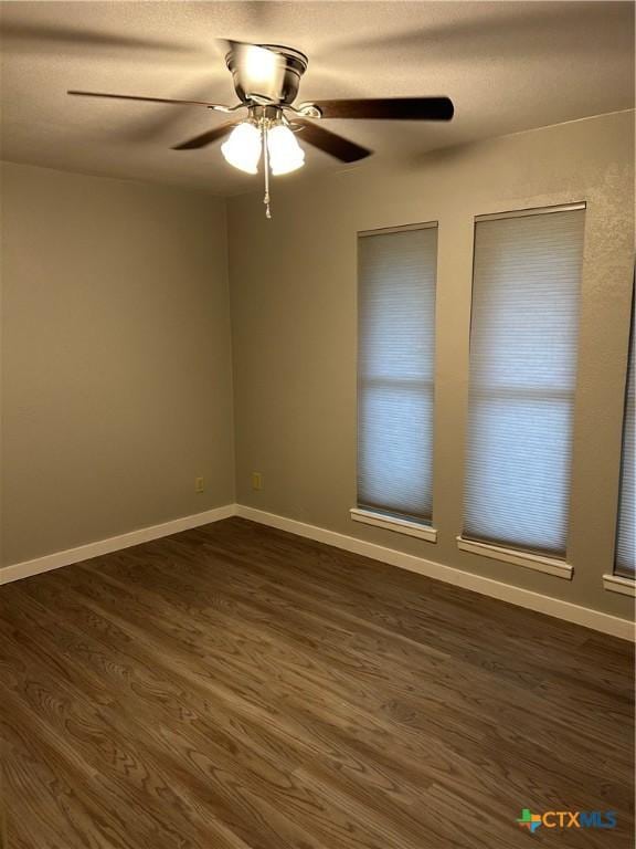 3705 Oakridge Blvd, Harker Heights, TX 76548 - empty room featuring dark wood-type flooring, a ceiling fan, and baseboards