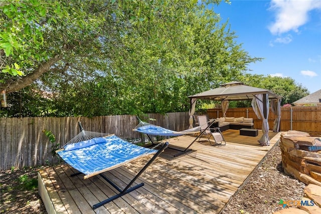 2123 Grizzly Trl, Harker Heights, TX 76548 - deck featuring an outdoor living space, a gazebo, and a fenced backyard