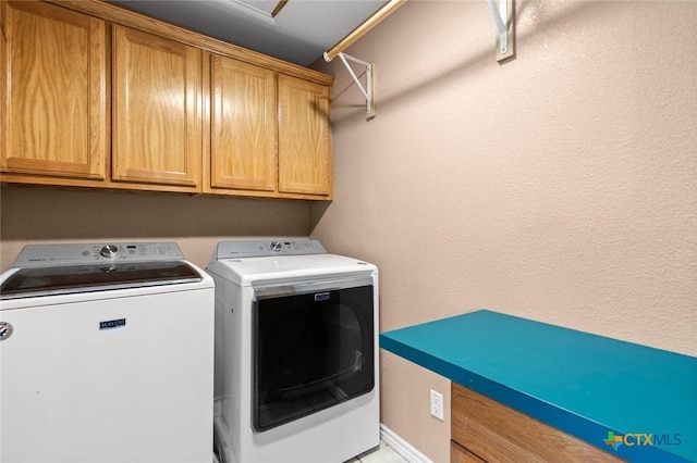 2123 Grizzly Trl, Harker Heights, TX 76548 - laundry area with washing machine and clothes dryer and cabinet space