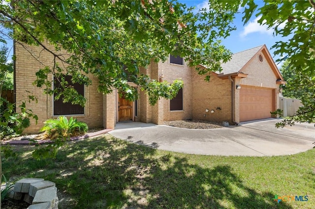 2123 Grizzly Trl, Harker Heights, TX 76548 - view of front facade featuring an attached garage, brick siding, concrete driveway, and a front lawn