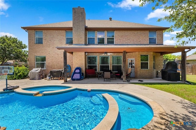 2123 Grizzly Trl, Harker Heights, TX 76548 - rear view of house featuring ceiling fan, a patio area, brick siding, and a chimney