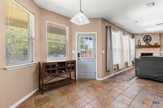 2123 Grizzly Trl, Harker Heights, TX 76548 - doorway to outside featuring stone tile floors and a stone fireplace