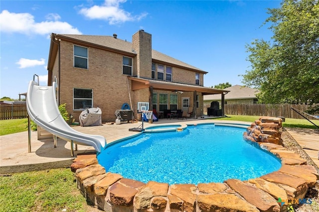 2123 Grizzly Trl, Harker Heights, TX 76548 - view of pool with a water slide, a fenced backyard, a patio, a ceiling fan, and a pool with connected hot tub