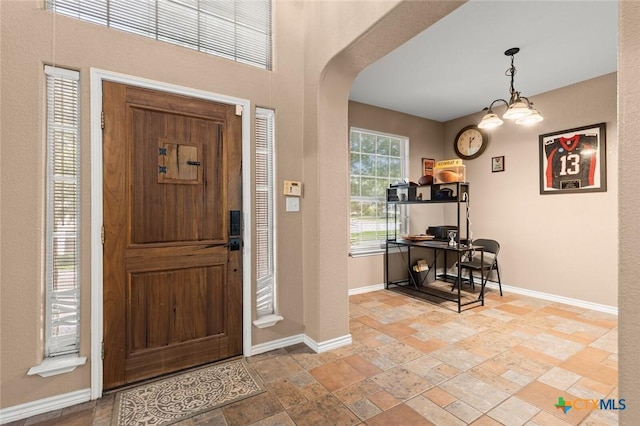 2123 Grizzly Trl, Harker Heights, TX 76548 - foyer entrance featuring stone tile flooring and arched walkways