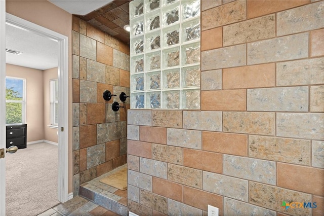 2123 Grizzly Trl, Harker Heights, TX 76548 - bathroom featuring a walk in shower and baseboards