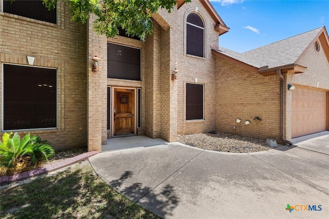 2123 Grizzly Trl, Harker Heights, TX 76548 - view of front facade featuring brick siding, a garage, and a shingled roof