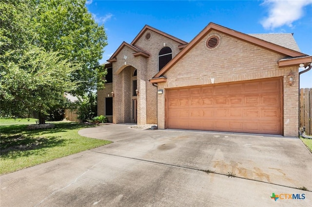2123 Grizzly Trl, Harker Heights, TX 76548 - view of front of home featuring brick siding, driveway, and an attached garage