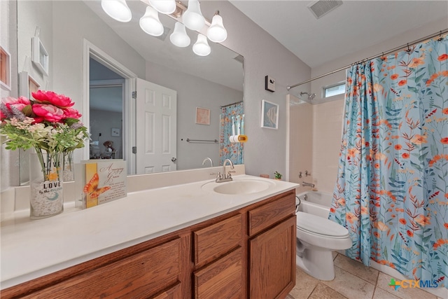 full bathroom featuring tile patterned flooring, vanity, shower / bath combo with shower curtain, and toilet