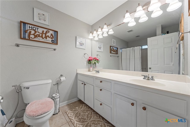 bathroom with vanity, a shower with shower curtain, tile patterned floors, and toilet