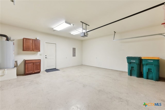 garage featuring water heater and a garage door opener