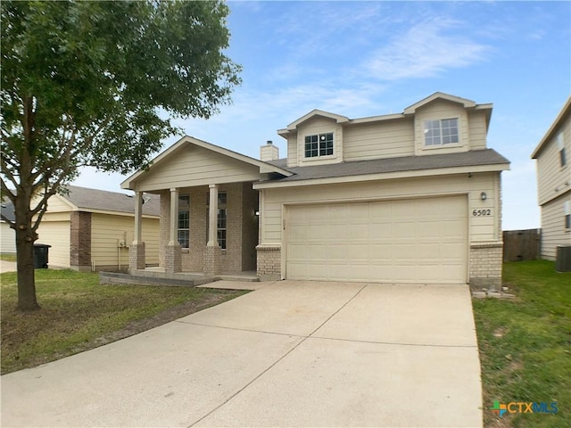 6502 Griffith Loop, Killeen, TX 76549 - view of front of property featuring a porch, driveway, a front yard, a garage, and brick siding