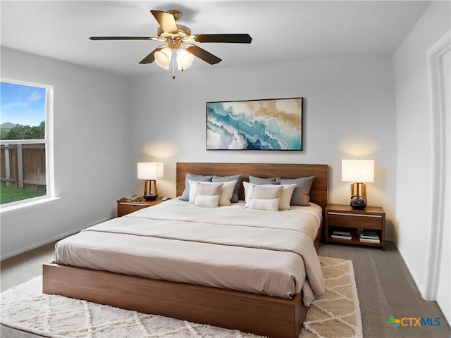 6502 Griffith Loop, Killeen, TX 76549 - carpeted bedroom with baseboards and a ceiling fan