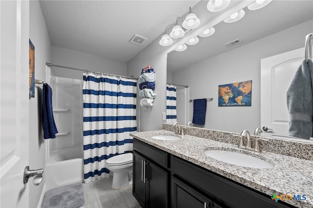 27522 Paraiso Sands, Boerne, TX 78015 - full bath with double vanity, shower / tub combo, and a textured ceiling