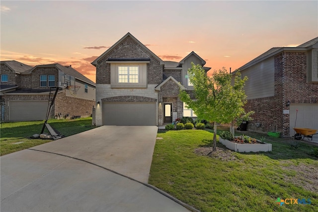 27522 Paraiso Sands, Boerne, TX 78015 - traditional-style house featuring an attached garage, driveway, a front yard, brick siding, and stone siding