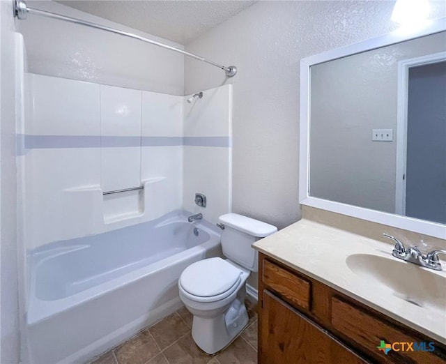 full bathroom with vanity, toilet, a textured ceiling, washtub / shower combination, and tile patterned flooring