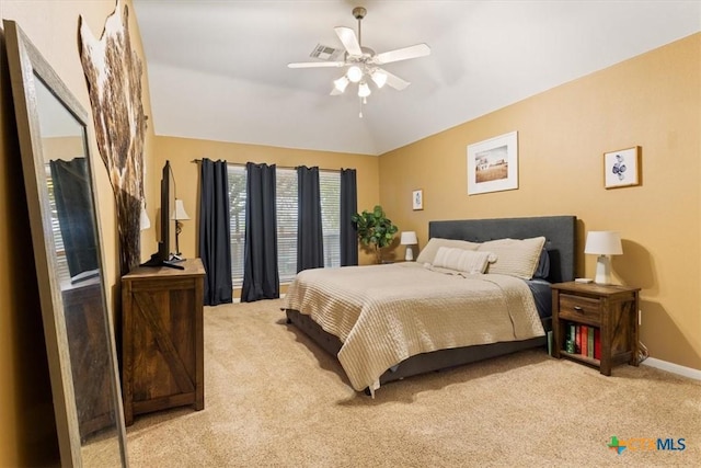 bedroom with ceiling fan and light carpet