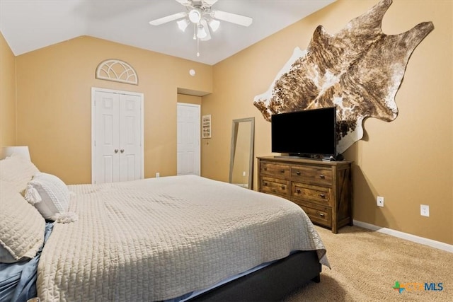 carpeted bedroom featuring ceiling fan and lofted ceiling