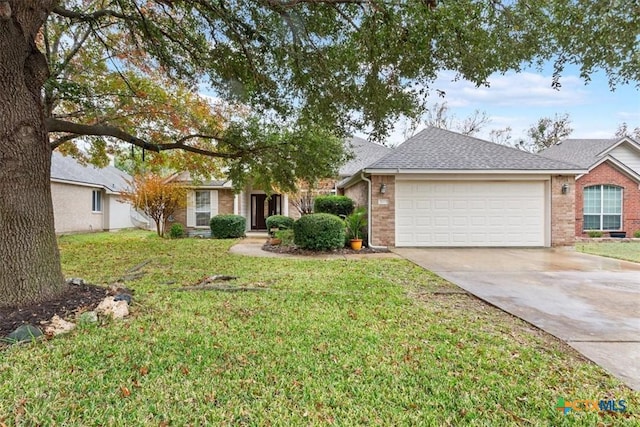 ranch-style house featuring a front yard and a garage