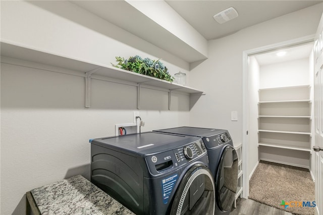 3130 Wigeon Way, Copperas Cove, TX 76522 - laundry room with washing machine and dryer and wood finished floors