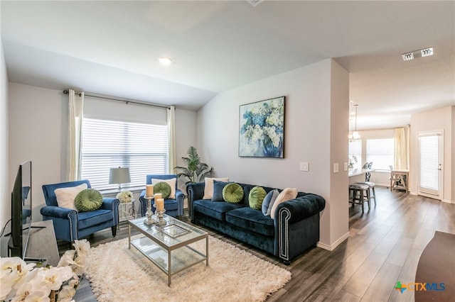 3130 Wigeon Way, Copperas Cove, TX 76522 - living room with dark wood-style floors, a chandelier, and vaulted ceiling