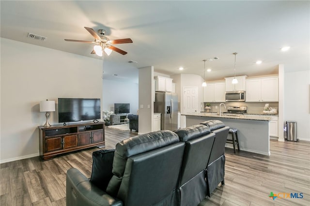 3130 Wigeon Way, Copperas Cove, TX 76522 - living area with ceiling fan, light wood-style floors, and recessed lighting
