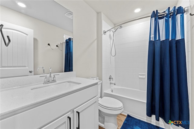 full bathroom with toilet, shower / tub combo, vanity, and hardwood / wood-style flooring