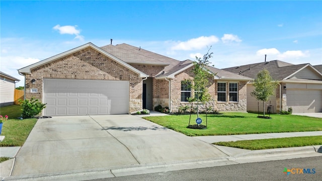 ranch-style home with a garage and a front yard