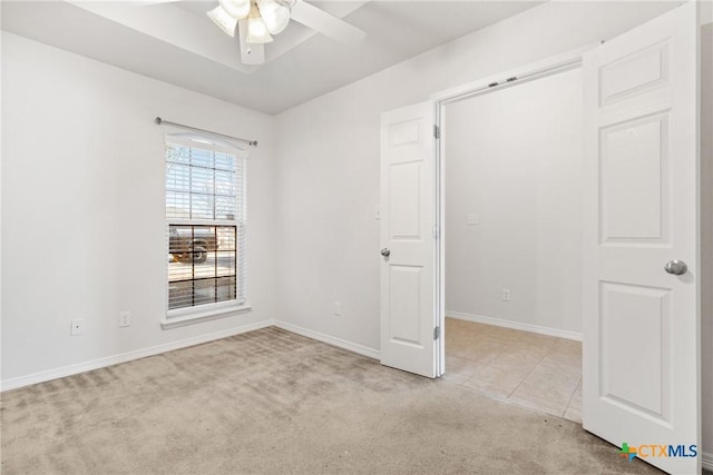 unfurnished room with light carpet and ceiling fan