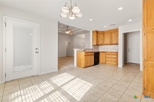 kitchen with sink, light tile patterned floors, ceiling fan with notable chandelier, decorative backsplash, and kitchen peninsula