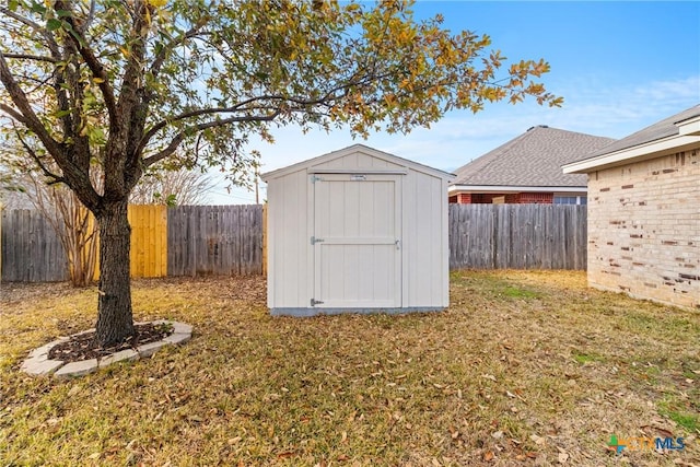 view of outdoor structure with a lawn