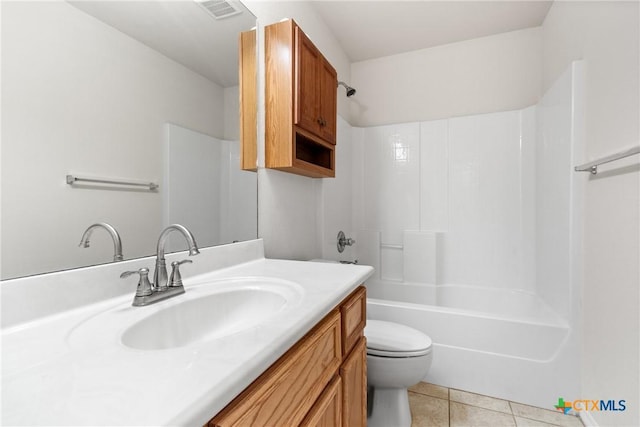 full bathroom with vanity, tile patterned floors, toilet, and shower / washtub combination