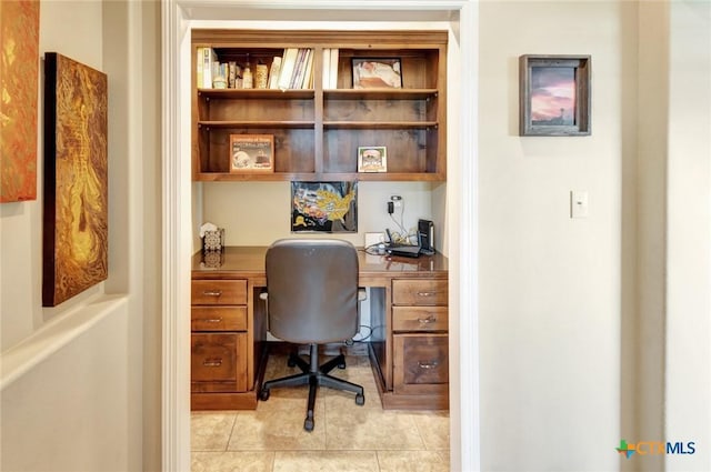 135 Wellspring Blvd, Victoria, TX 77904 - office area featuring built in study area and light tile patterned flooring