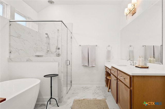 full bath featuring vanity, baseboards, a freestanding bath, a shower stall, and marble finish floor