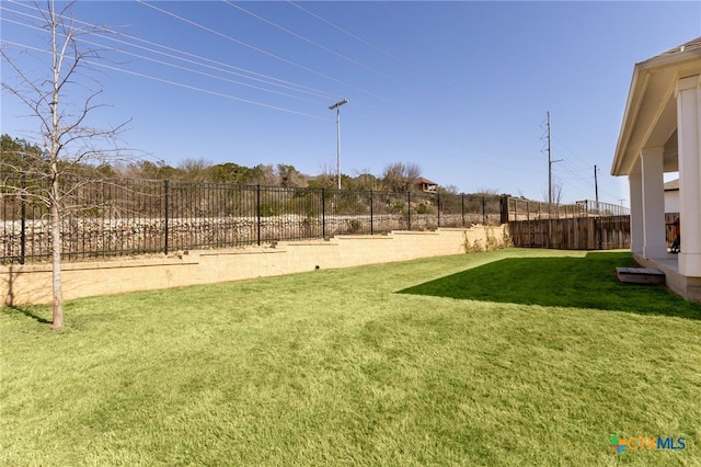 view of yard with a fenced backyard