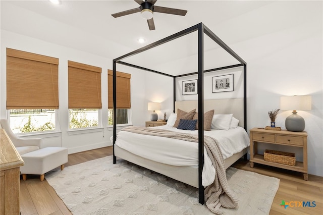 bedroom with a ceiling fan, recessed lighting, and light wood-type flooring