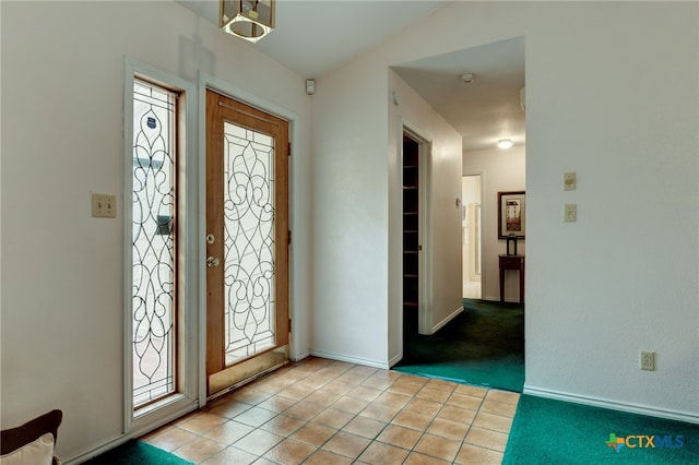 foyer featuring a healthy amount of sunlight and light tile patterned floors